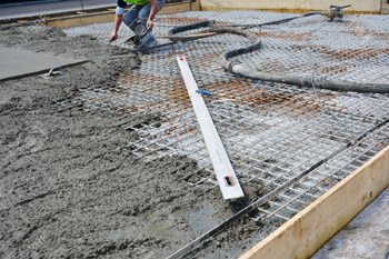 Worker prepring land for Rcc Reinforced Cement Concrete